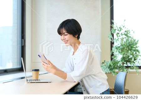 Young woman in the office Telework Remote work 104426629
