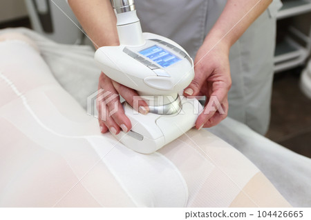 Anti-cellulite hardware body massage. Correction of the figure. Massage to strengthen muscle tone.Lpg massage procedure. 104426665