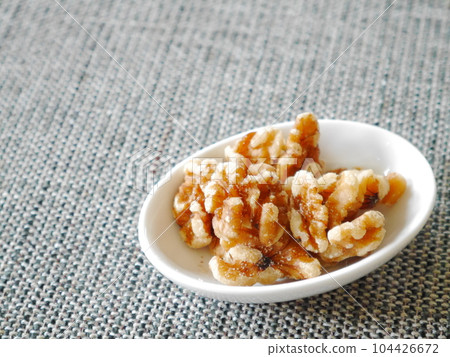 walnuts on a plate walnuts on a plate 104426672