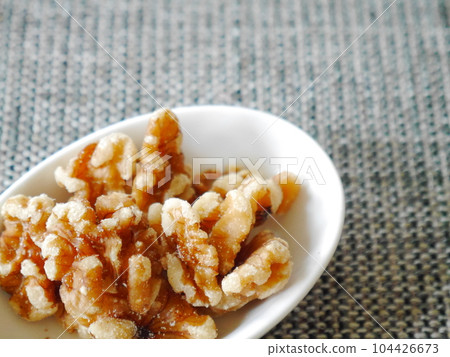 walnuts on a plate walnuts on a plate 104426673