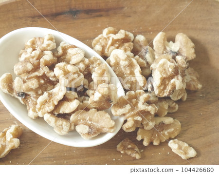 walnuts on a plate walnuts on a plate 104426680