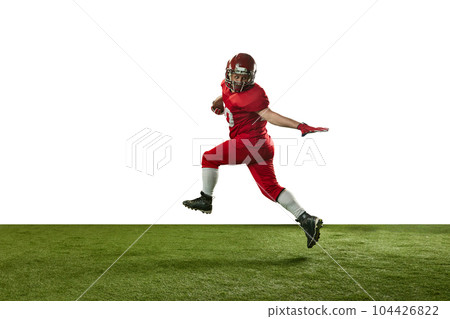 Man, american football player in red uniform catching ball and running on field against white background 104426822