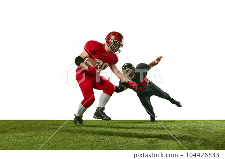Dynamic image of two men in uniform american football players in motions on field during tense game against white background 104426833