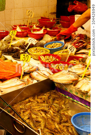 Fish sold at a market in North Point of Hong Kong Island. Many fish are unfamiliar in Japan 104426949