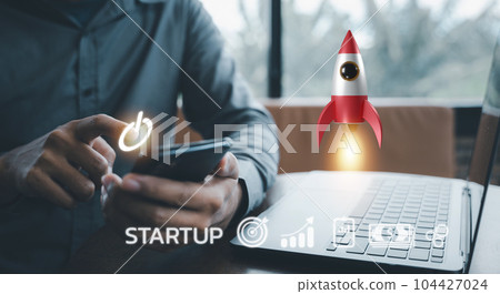 Watch your startup soar with this white rocket icon launching from a laptop, representing innovation, progress, and financial success. Network connection on modern virtual interface. 104427024
