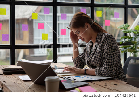 Stressed and Burnout. Business woman worry about her work at office Stressed and Burnout. Business woman worry about her work at office 104427641