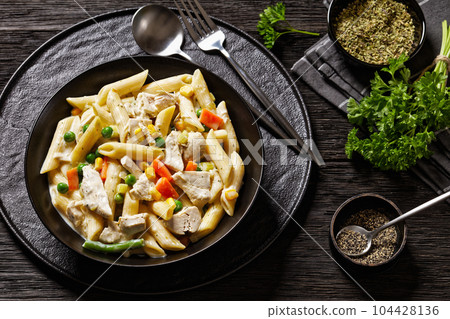 Creamy Chicken and Penne Pasta Casserole in bowl 104428136