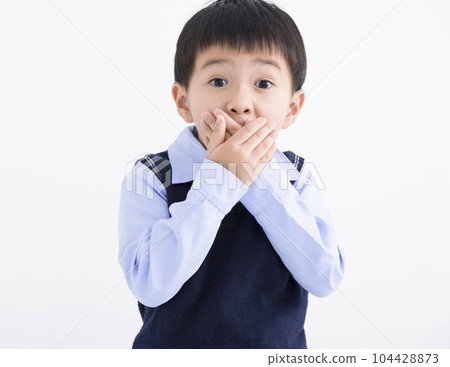 Little boy kid  shocked and hand covering mouth 104428873