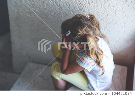 Lonely Upset Little Preschool Girl at Home. Sad Child Alone. Emotional Stress of Children, School, and Family Problems. 104431084