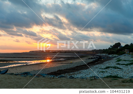 Sunrise view of coastal street of Grandcamp Maisy, a scenic French coastal town in Normandy, with fishing port, sandy beaches, and maritime traditions. Sunrise view of coastal street of Grandcamp Maisy, a scenic French coastal town in Normandy, with fishing port, sandy beaches, and maritime traditions. 104431219
