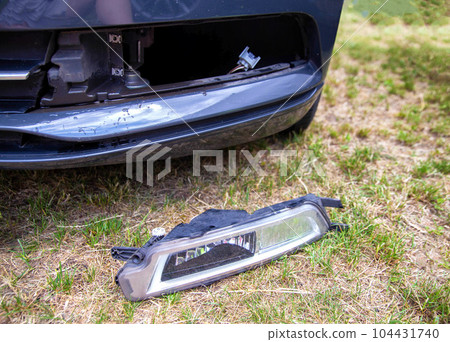 Removed fog lamp from a car to replace a burnt out light bulb. Close-up Removed fog lamp from a car to replace a burnt out light bulb. Close-up 104431740