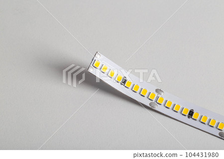 Superbright diode tape on a white background, lighting. Macro 104431980