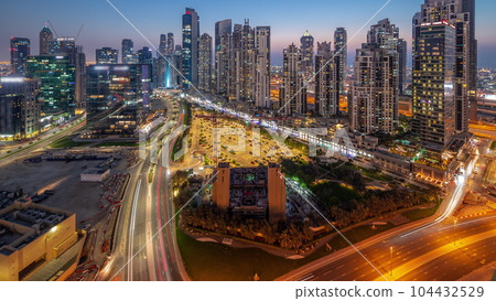 Bay Avenue with modern towers residential development in Business Bay aerial panoramic day to night timelapse, Dubai 104432529