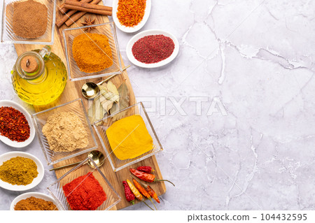 Various dried spices in small bowls Various dried spices in small bowls 104432595