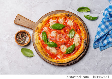 Margarita pizza with tomatoes, mozzarella cheese and basil Margarita pizza with tomatoes, mozzarella cheese and basil 104432651