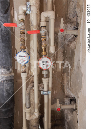 Water meters and polypropylene pipes for cold and hot water. Price per cubic meter of water. Close-up 104433035