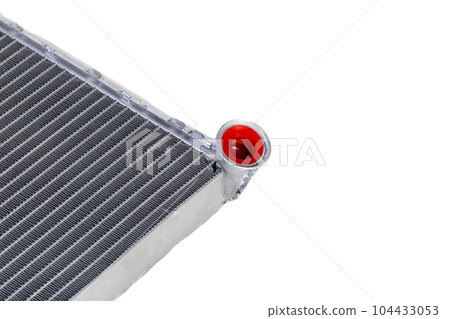 Aluminum radiator of a car stove on a white background, close-up, isolated Aluminum radiator of a car stove on a white background, close-up, isolated 104433053