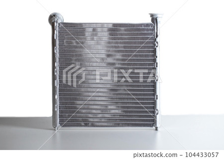 Aluminum radiator of a car stove on a white background, close-up, isolated 104433057
