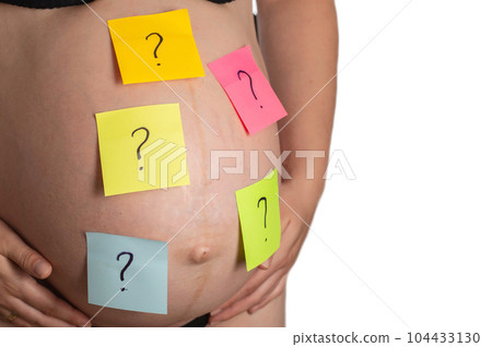 Multi-colored stickers with a question mark are glued on the belly of a pregnant girl. The concept of the uncertainty of the birth of a boy or girl. Copy space for text Multi-colored stickers with a question mark are glued on the belly of a pregnant girl. The concept of the uncertainty of the birth of a boy or girl. Copy space for text 104433130