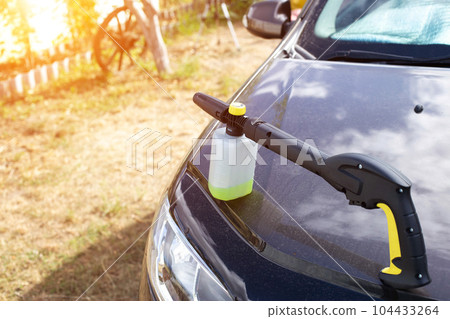 Nozzle foam generator for a sink of a high pressure. car chemicals, shampoo concentrate. Car care. copy space for text 104433264