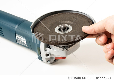 Installation of a reinforced grinding wheel on a grinder for metal processing. Installation of a reinforced grinding wheel on a grinder for metal processing. 104433294