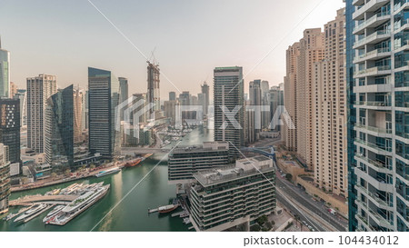 Panorama showing overview to JBR and Dubai Marina skyline with modern high rise skyscrapers waterfront living apartments aerial timelapse Panorama showing overview to JBR and Dubai Marina skyline with modern high rise skyscrapers waterfront living apartments aerial timelapse 104434012