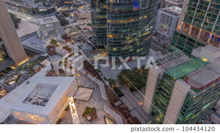 Dubai international financial center skyscrapers aerial day to night timelapse. Dubai international financial center skyscrapers aerial day to night timelapse. 104434120