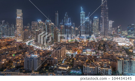 Dubai Downtown day to night transition timelapse with tallest skyscraper and other towers 104434145