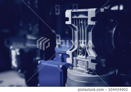 A large number of pneumatic equipment in the production storage warehouse. Pneumatic control cylinders. Toned Image A large number of pneumatic equipment in the production storage warehouse. Pneumatic control cylinders. Toned Image 104434902