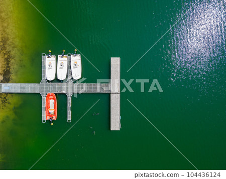 Aerial view of the sailing club. Aerial top-down view of docked sailboats in marine bay. Top down Aerial view of the sailing club. Aerial top-down view of docked sailboats in marine bay. Top down 104436124