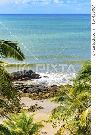 Tropical beach with vividly colored waters Tropical beach with vividly colored waters 104436804