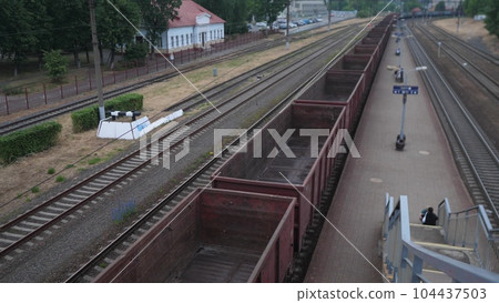 empty freight train slowly moving empty freight train slowly moving 104437503