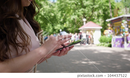 phone and woman in park for typing social phone and woman in park for typing social 104437522