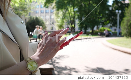Woman hands using smartphone Woman hands using smartphone 104437523