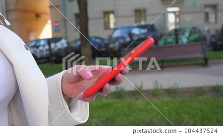 Woman hands using smartphone Woman hands using smartphone 104437524