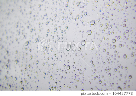Macro shot of water droplets on glass Macro shot of water droplets on glass 104437778