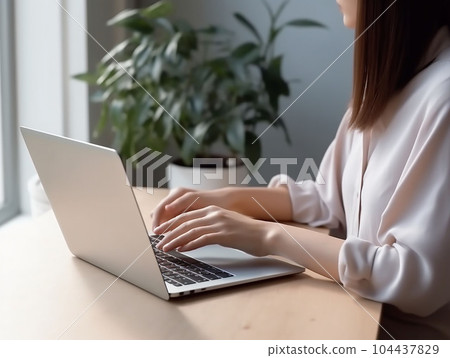 hands of a young woman working on a computer hands of a young woman working on a computer 104437829