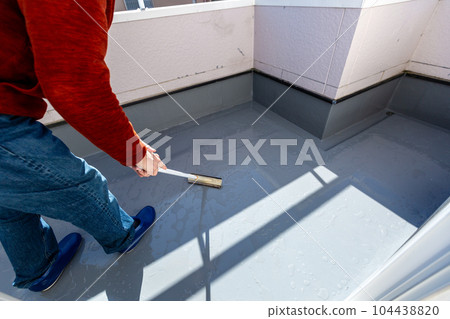 A man cleaning the balcony Balcony A man cleaning the balcony Balcony 104438820
