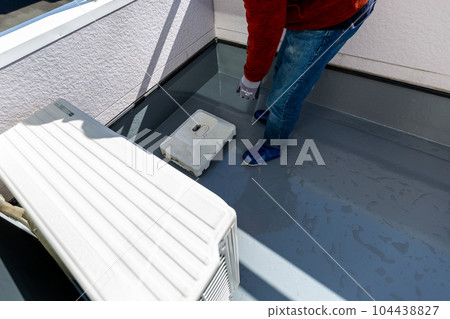 A man cleaning the balcony Balcony A man cleaning the balcony Balcony 104438827