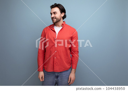 handsome brutal young brunette man in red shirt 104438950