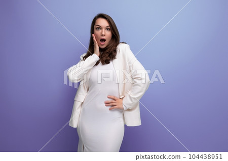shocked surprised brunette business young woman in dress and jacket 104438951