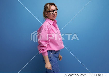 young smart successful caucasian blond leader woman with ponytail with glasses wearing pink blouse young smart successful caucasian blond leader woman with ponytail with glasses wearing pink blouse 104438968