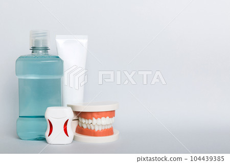 Mouthwash and other oral hygiene products on colored table top view with copy space. Flat lay. Dental hygiene. Oral care kit. Dentist concept 104439385