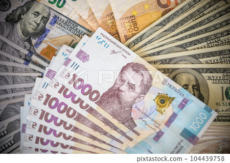 Dollar banknotes of the USA. Amerikan dollars. Money of USA and Ukrainian hryvnia. 1000 Ukrainian hryvnia 104439758