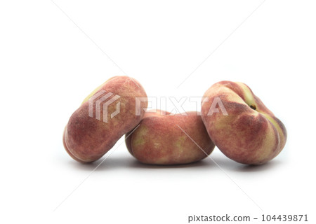Closeup of flat peaches on white background Closeup of flat peaches on white background 104439871