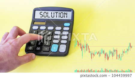 Making business decision about outsourcing. Printed decision tree and calculator, top view. Making business decision about outsourcing. Printed decision tree and calculator, top view. 104439997