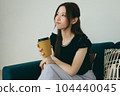 A woman relaxing on the sofa 104440045
