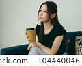 A woman relaxing on the sofa 104440046