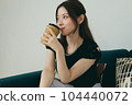 A woman relaxing on the sofa 104440072