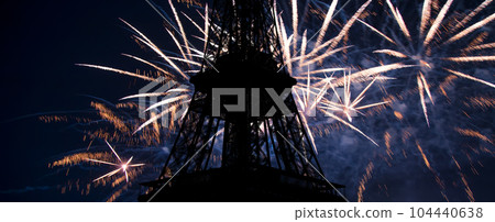 Celebratory colorful fireworks over the Eiffel Tower in Paris, France 104440638